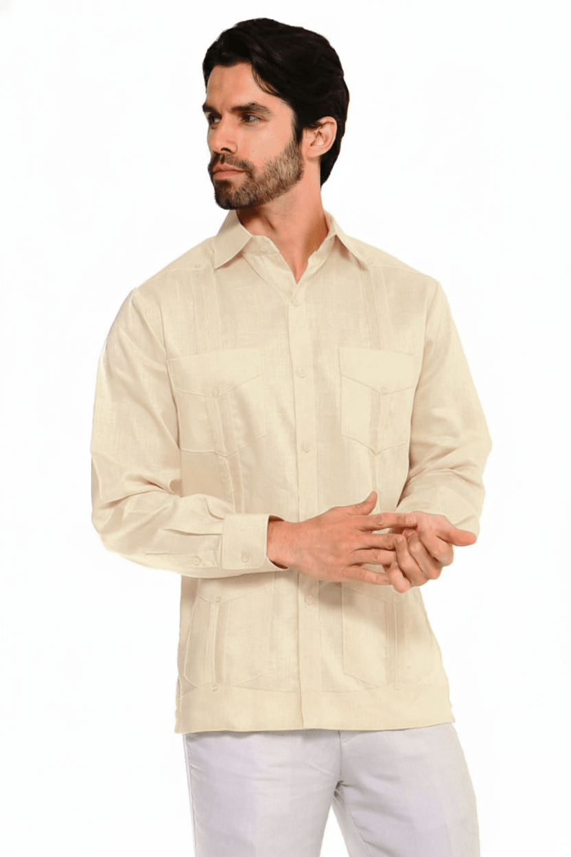 A man models the long-sleeved, four-pocket, beige Men's Plus Size Guayabera Shirt while clasping his hands.