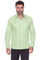 A man wearing a light green guayabera-style button-up shirt with vertical pleats and front chest pockets, paired with black pants, against a plain white background.
