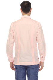 A man viewed from the back wearing a light pink long-sleeve shirt with vertical contrast stitching and blue jeans, set against a plain white background.