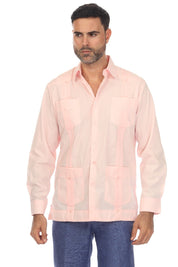 A man wearing a light pink guayabera-style button-up shirt with sheer mesh panels and blue patterned pants, photographed against a plain white background.