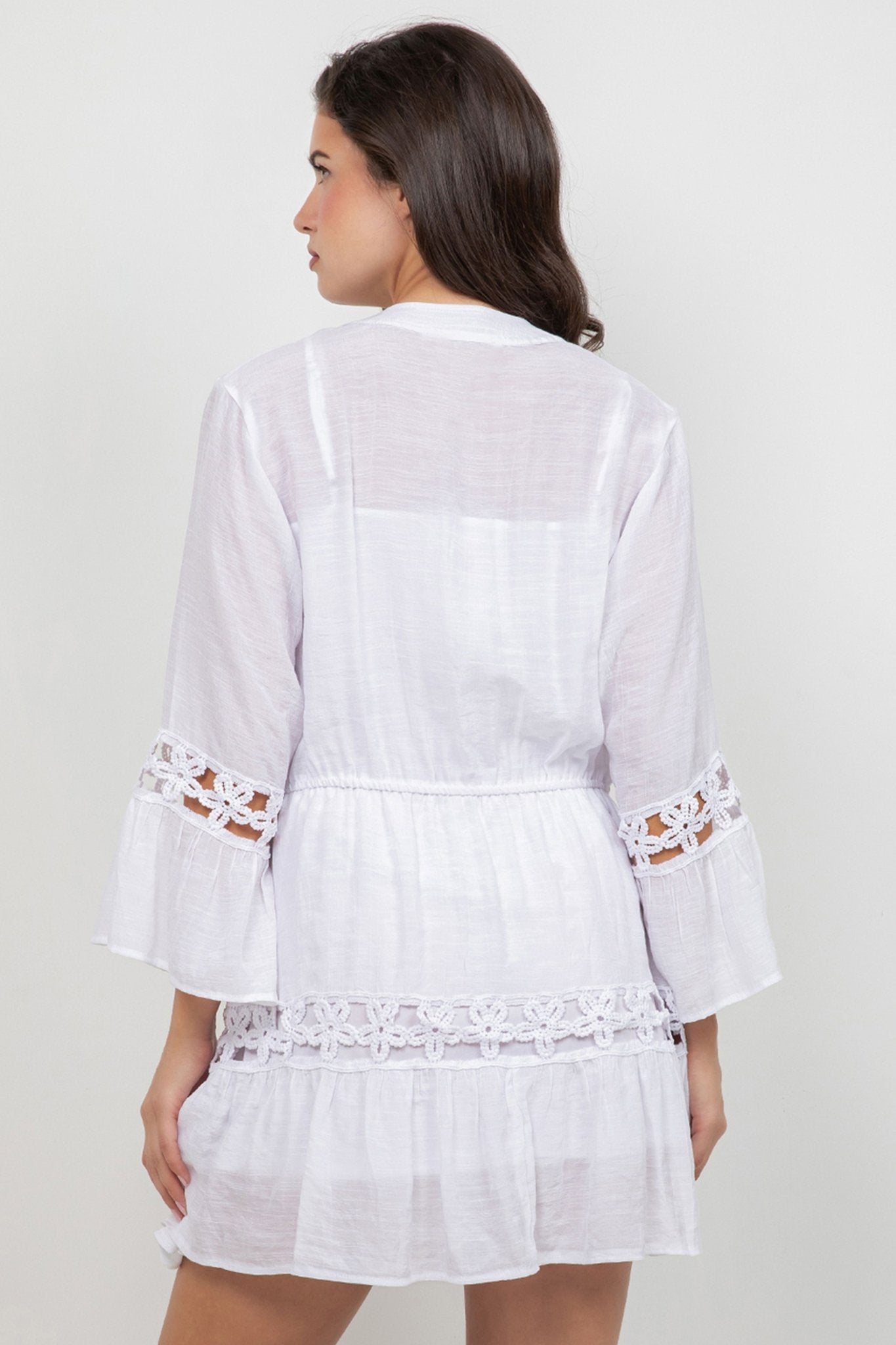 Back view of a woman wearing the white Ladies Boho Lace Trim Blouse with Tank 3/4 Dress Set, showing lace trim detail.