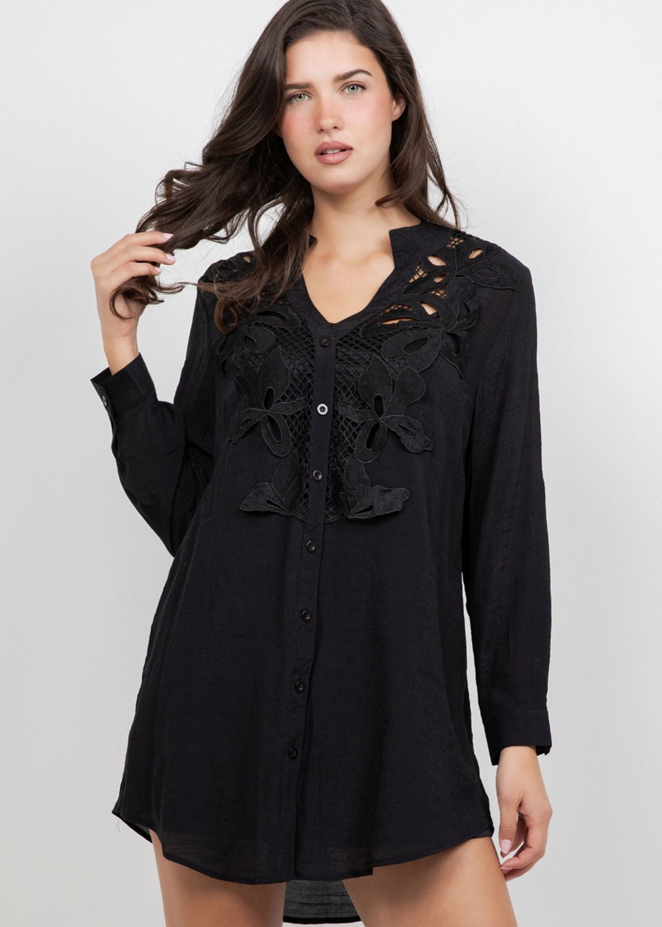 Model wears a long-sleeved Ladies Boho Lace Trim Blouse Dress Set in black with front lace detail.