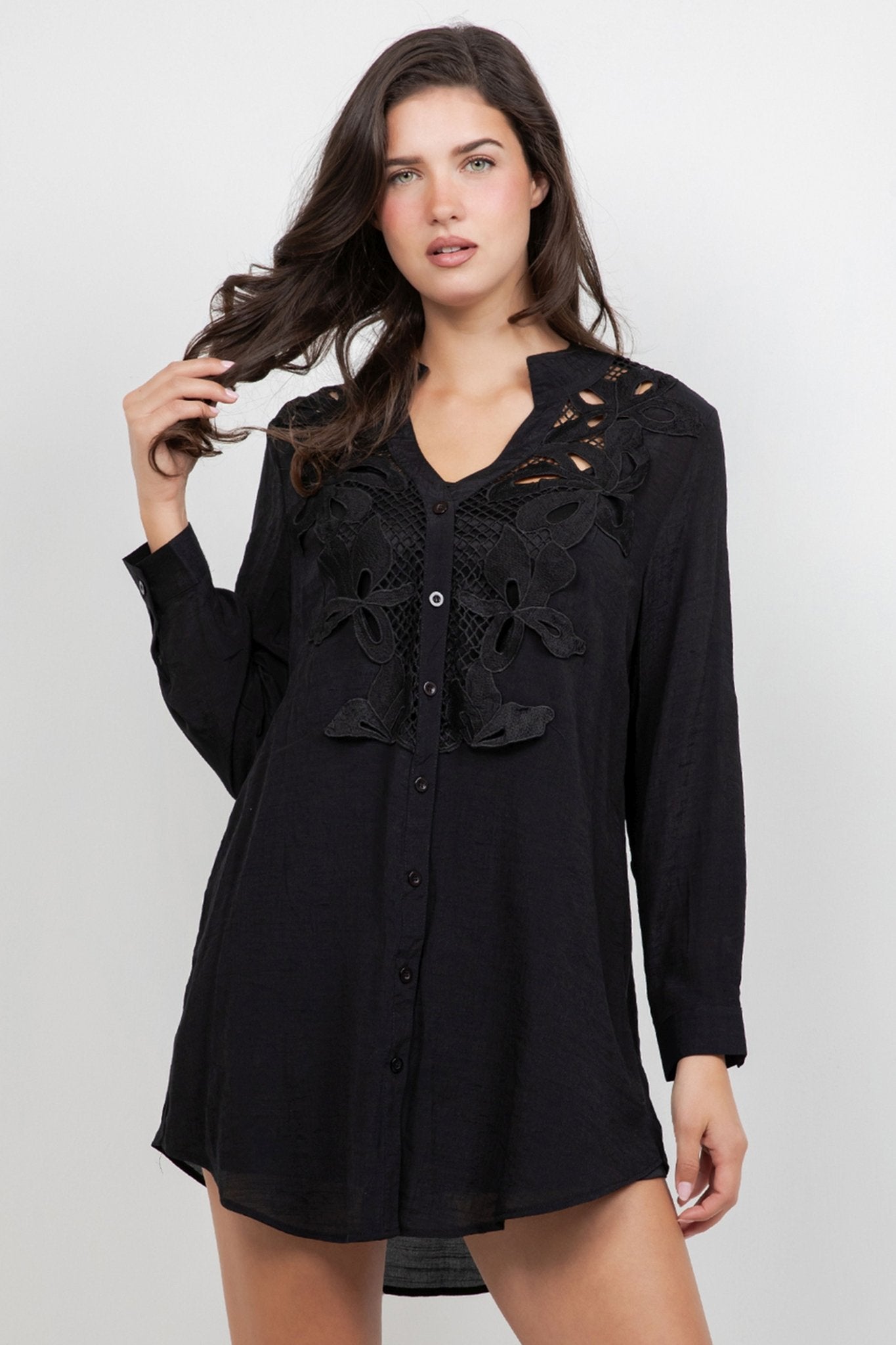 Model wears a long-sleeved Ladies Boho Lace Trim Blouse Dress Set in black with front lace detail.