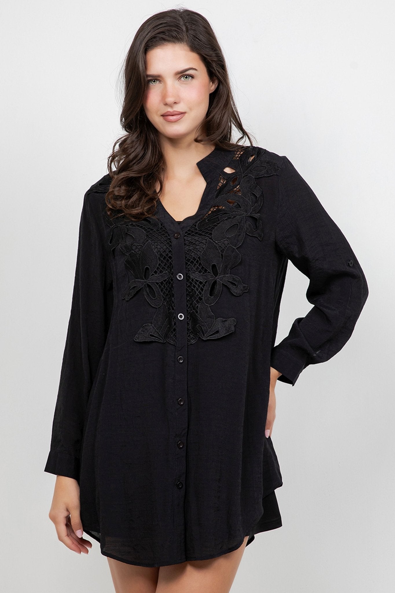 A woman models the black Ladies Boho Lace Trim Blouse with Tank Long-Sleeve Dress Set.