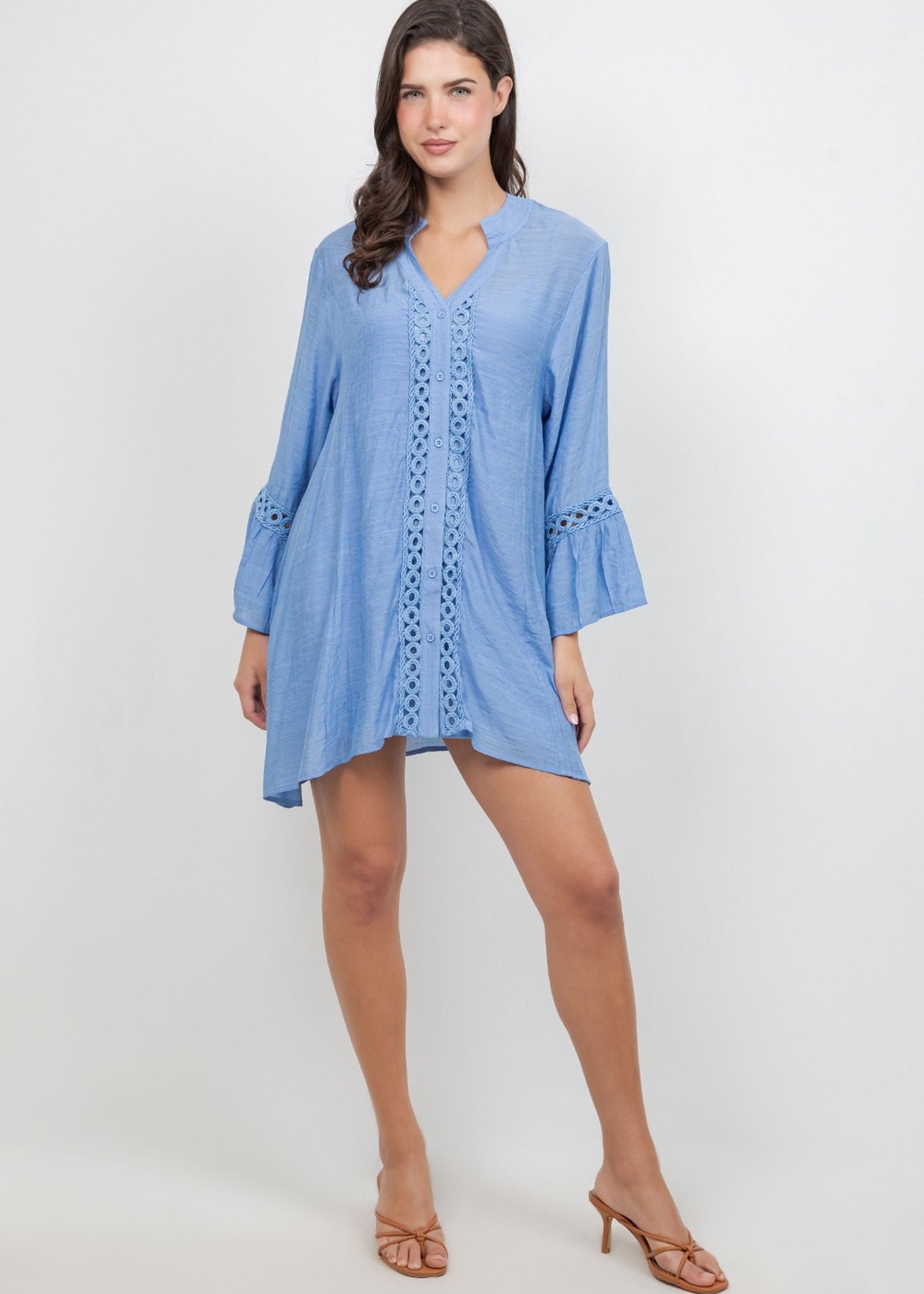 A woman models the light blue Ladies Boho Lace Trim Tunic Dress Set with lace detailing.