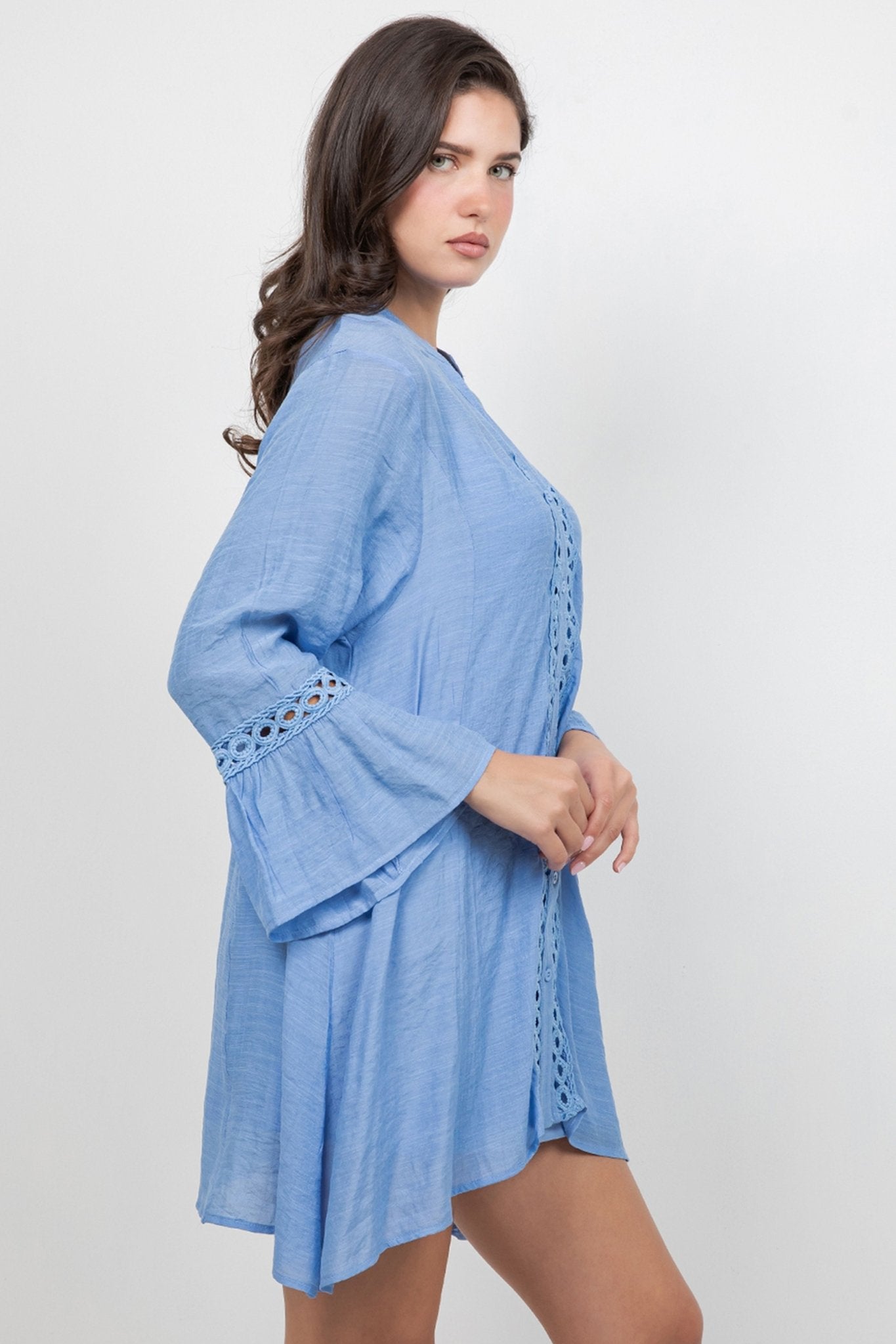 Model poses in a light blue Ladies Boho Lace Trim Tunic Dress Set, showing lace trim on the sleeves and front.