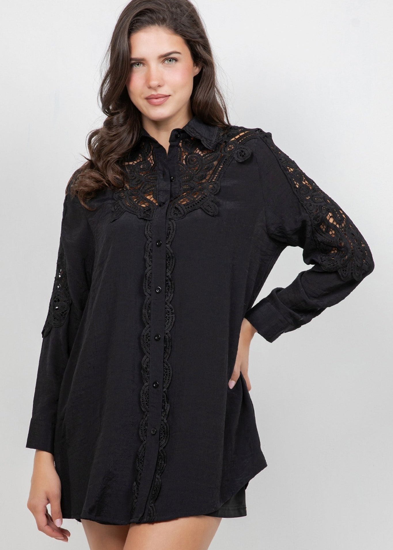 A woman models the Ladies Boho Lace Embroidered Tunic Shirt Dress Set, which is black with lace detail.