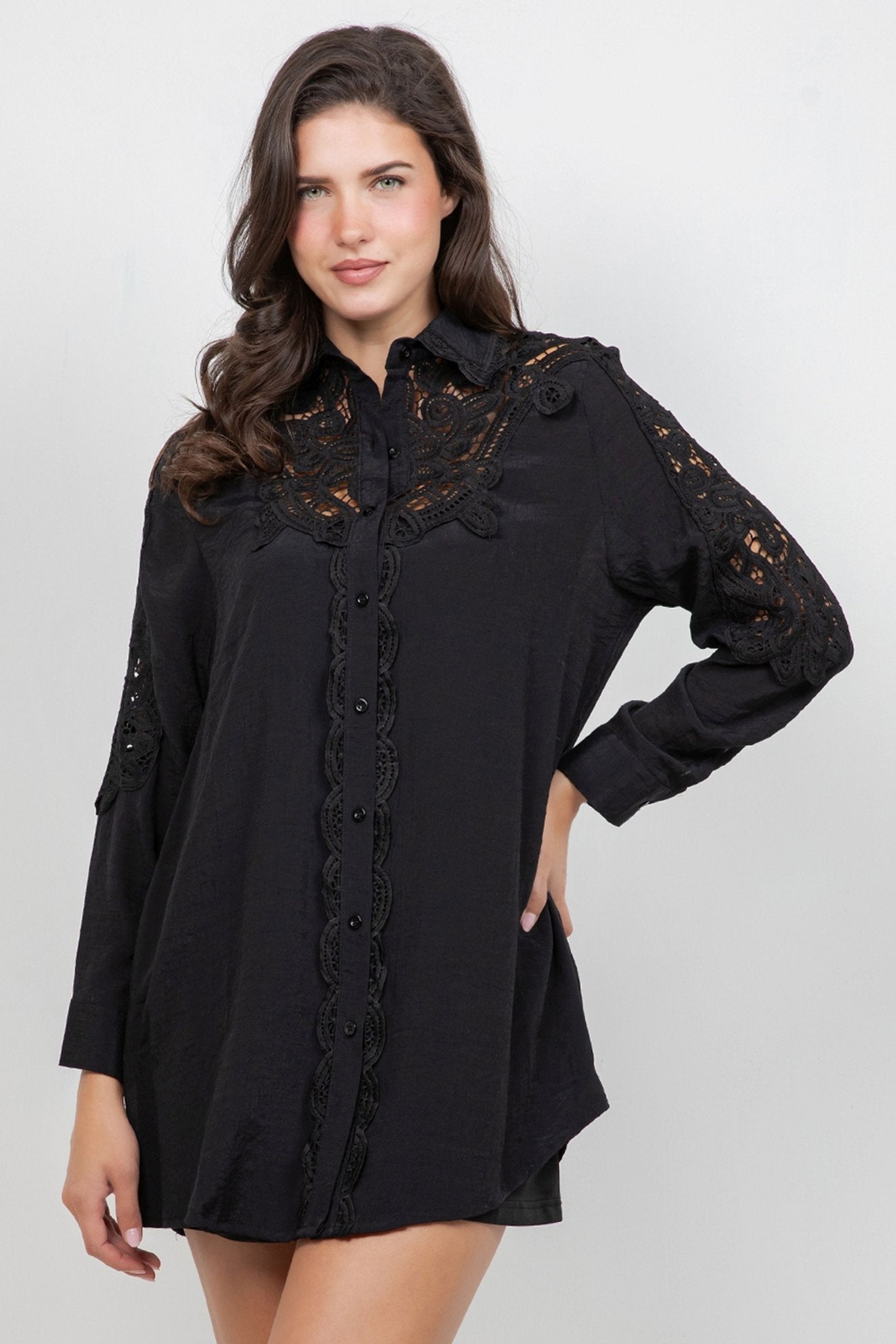 A woman models the Ladies Boho Lace Embroidered Tunic Shirt Dress Set, which is black with lace detail.
