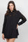 A woman models the Ladies Boho Lace Embroidered Tunic Shirt Dress Set, which is black with lace detail.