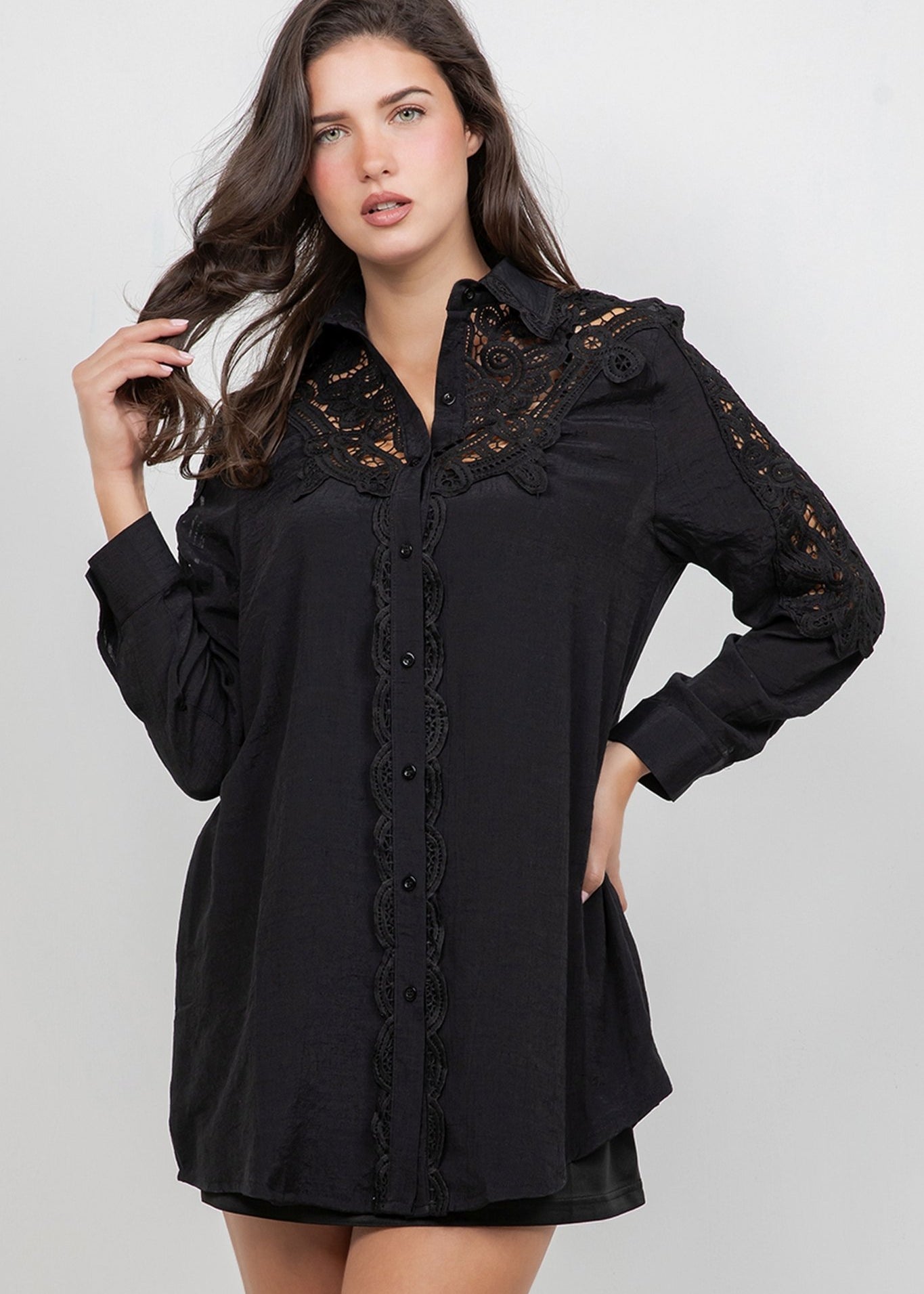 A woman models a black Ladies Boho Lace Embroidered Tunic Shirt Dress Set with lace detail.