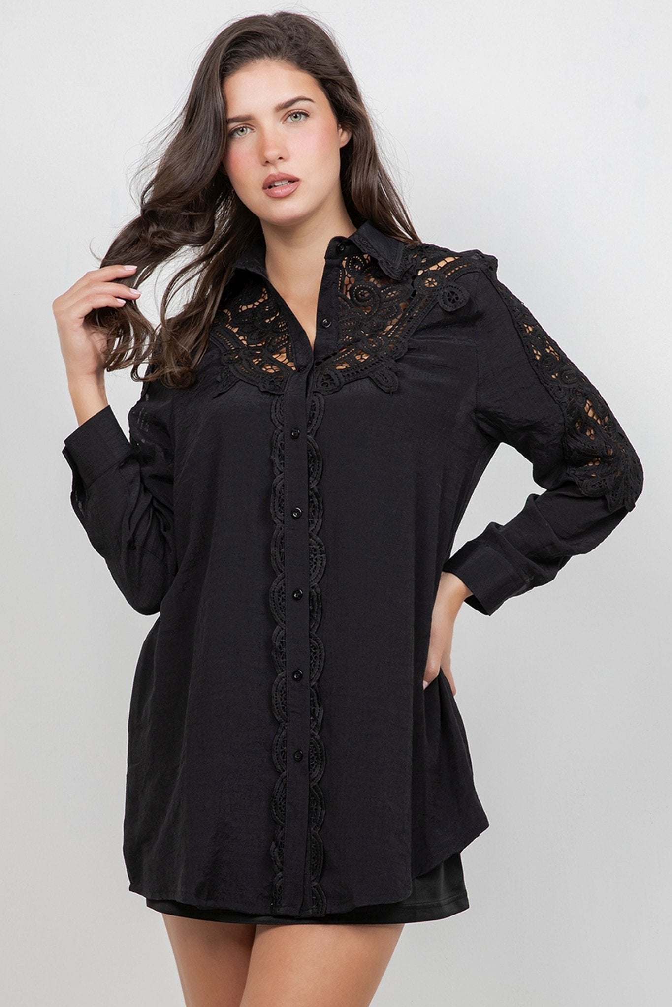 A woman models a black Ladies Boho Lace Embroidered Tunic Shirt Dress Set with lace detail.