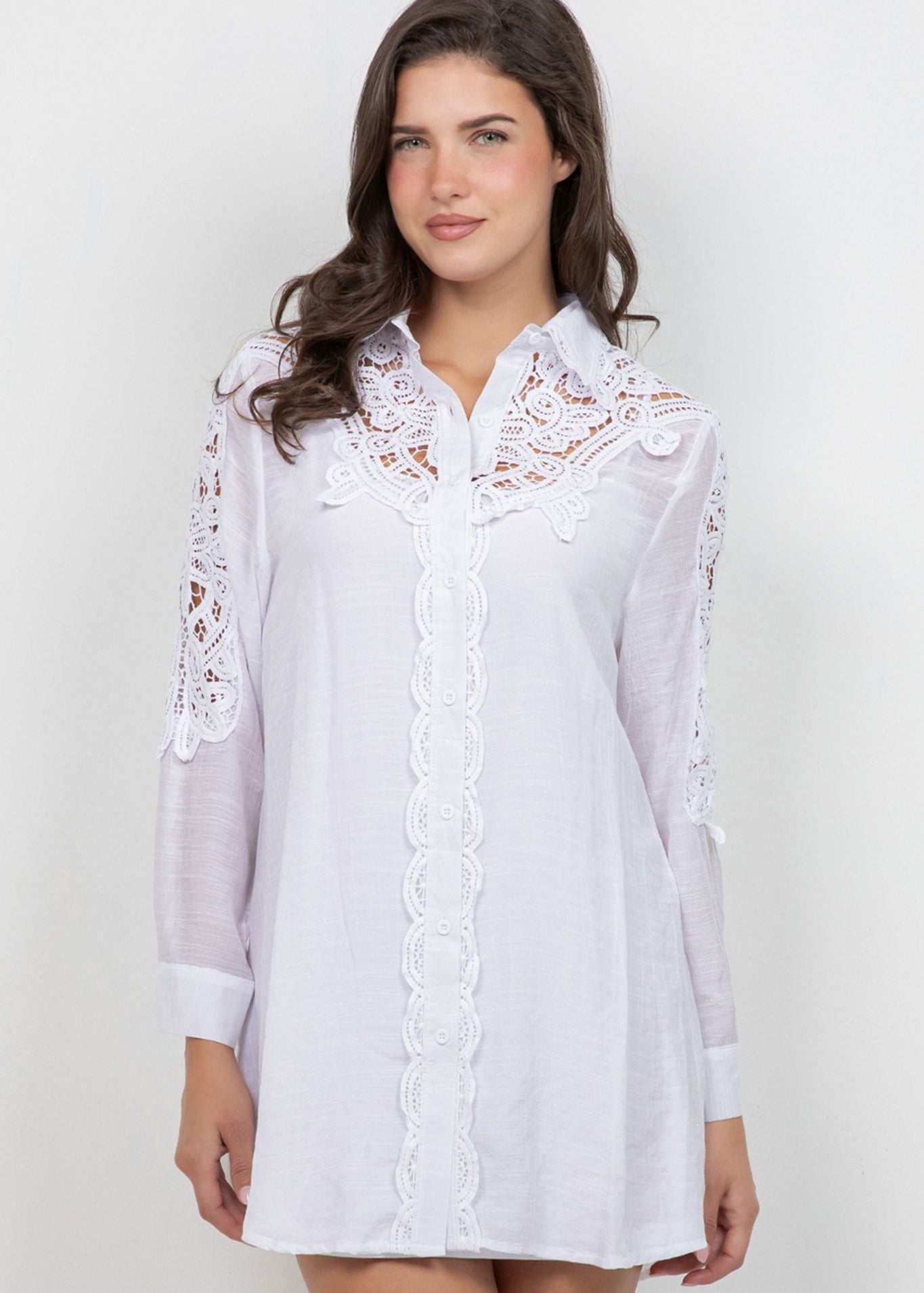 Front view of a woman wearing a white Ladies Boho Lace Embroidered Tunic Shirt Dress.