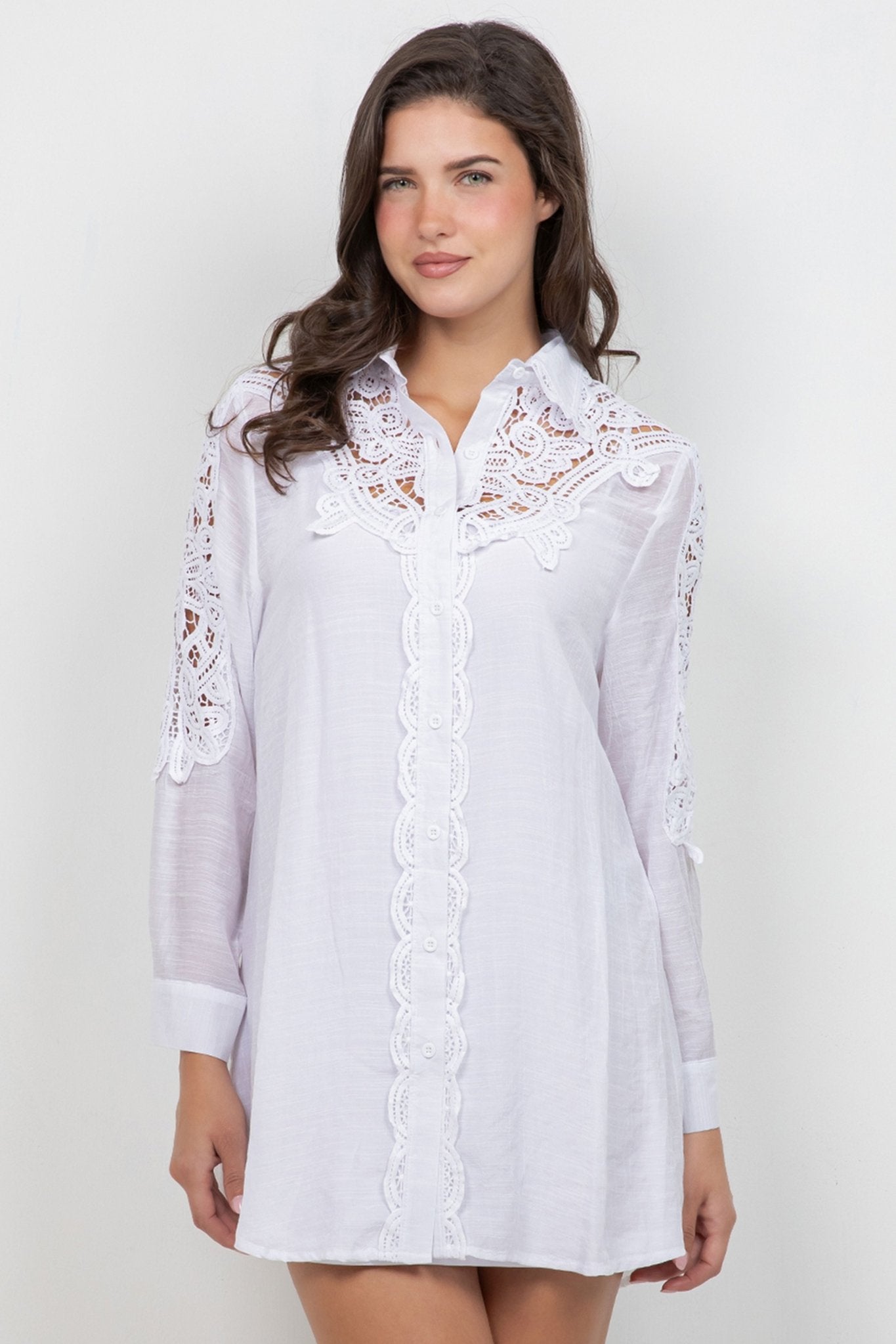 Front view of a woman wearing a white Ladies Boho Lace Embroidered Tunic Shirt Dress.