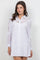 Front view of a woman wearing a white Ladies Boho Lace Embroidered Tunic Shirt Dress.