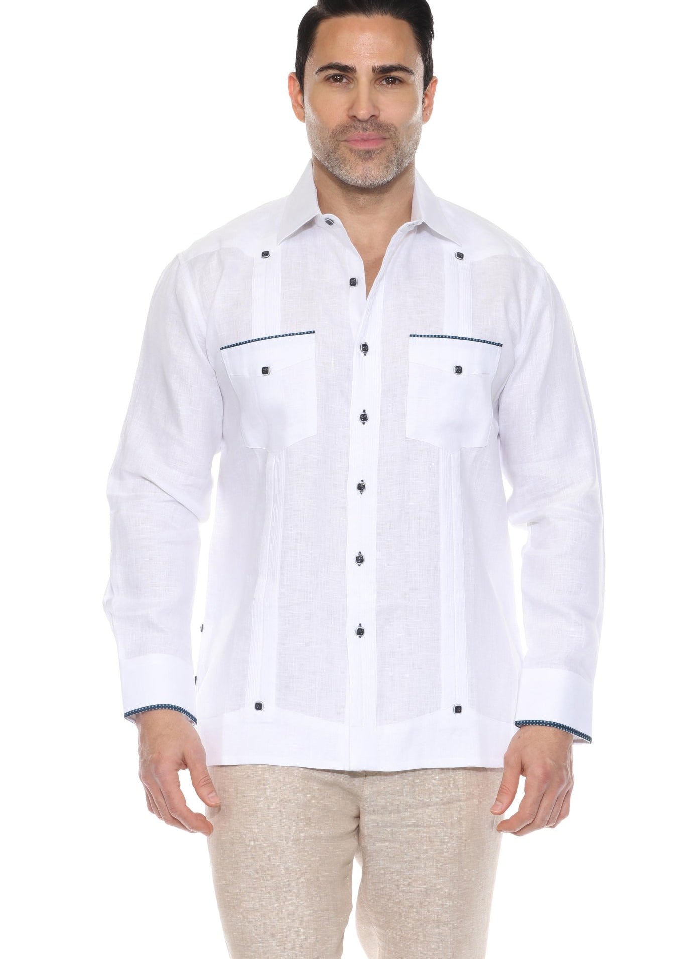 A classic white long sleeve linen guayabera shirt featuring navy blue pop-color trim on the pockets and cuffs.