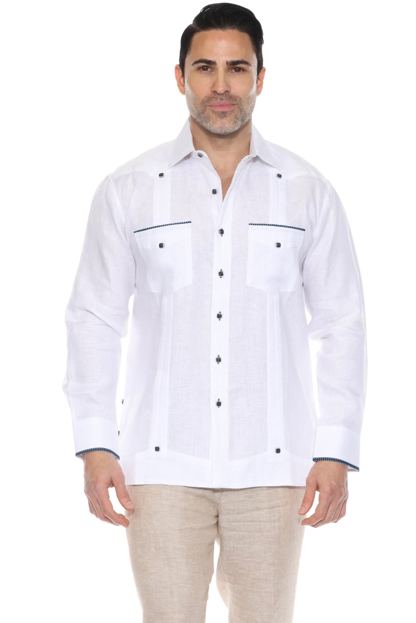 A classic white long sleeve linen guayabera shirt featuring navy blue pop-color trim on the pockets and cuffs.