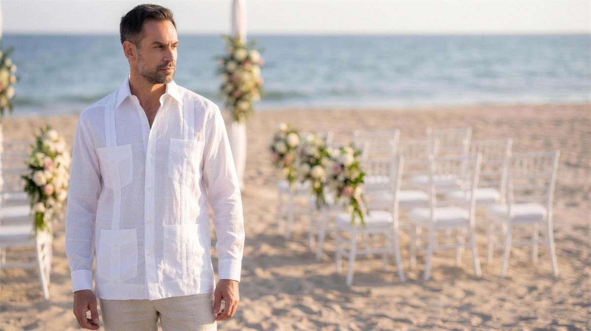 Groom in a white linen guayabera at a beach wedding ceremony
