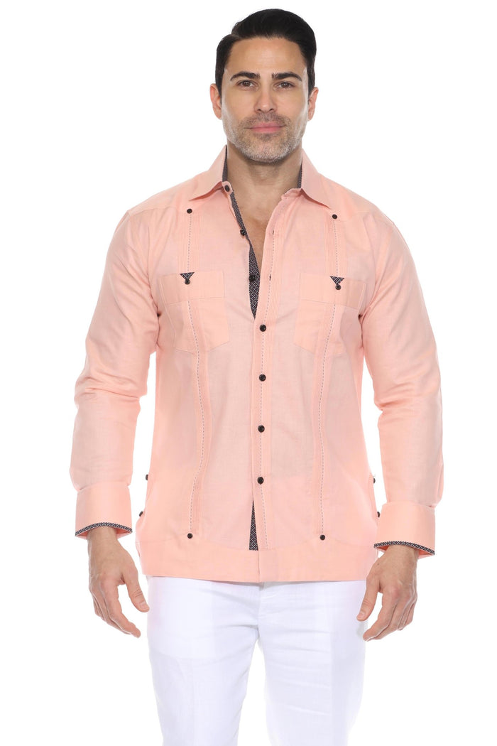 A man wearing a peach-colored Men’s Long Sleeve Linen Guayabera Cuban Shirt with blue printed trim on the collar and cuffs, featuring classic pleated front detailing for resort wear or tropical weddings.