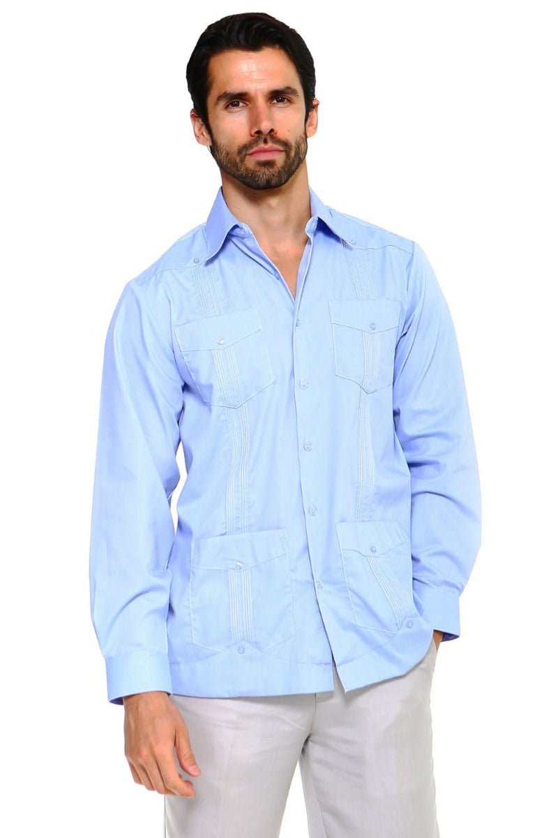 A man wears a light blue, long-sleeved, four-pocket Men’s Plus Size Guayabera Shirt.