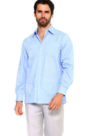 A man models the light blue, long-sleeved Men’s Plus Size Guayabera Shirt with four pockets.