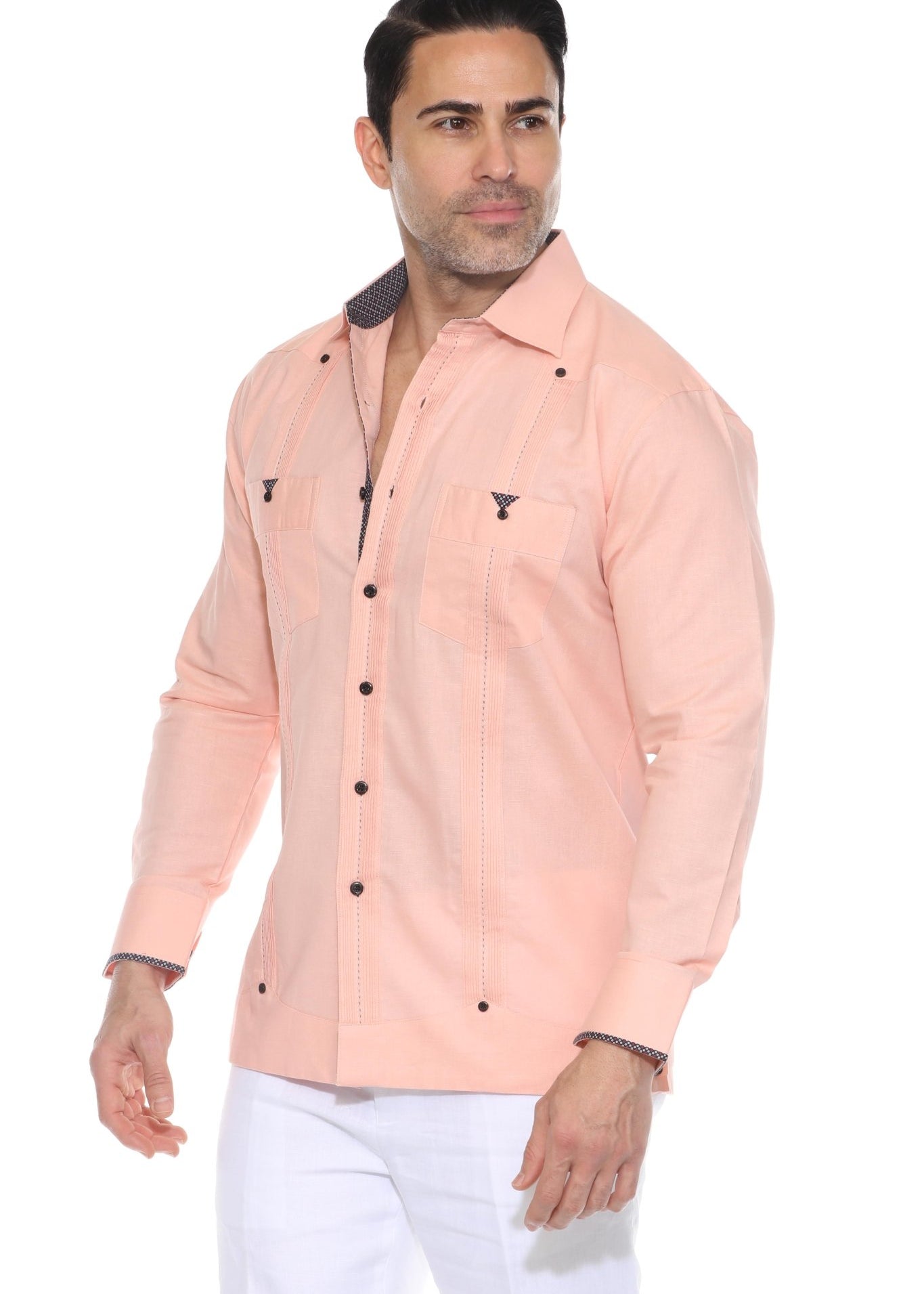 A studio shot of a different man wearing the peach Men’s Long Sleeve Linen Guayabera Shirt, clearly showing the contrast printed trim inside the collar, cuffs, and pocket edges.