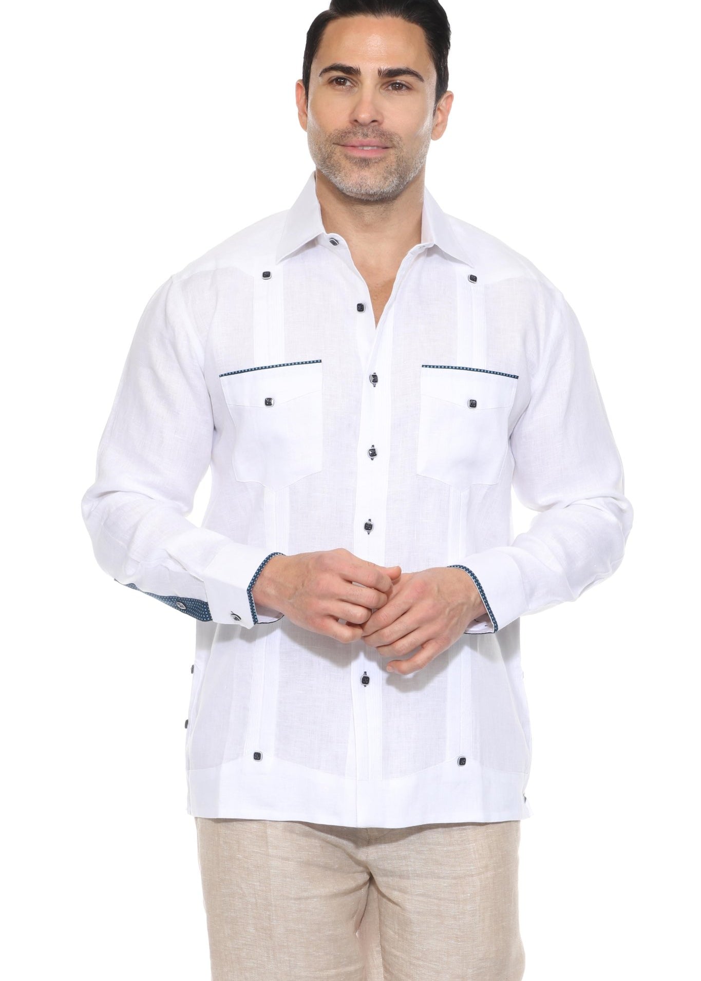 Front studio shot of a white men’s long sleeve premium linen guayabera shirt with blue contrast trim and pleats.