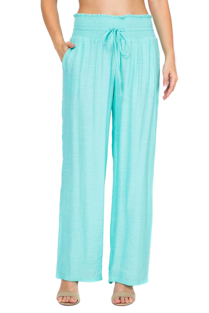 Front view of Ladies Smocked Waist Drawstring Palazzo Pants in white, with smocked waist detail.