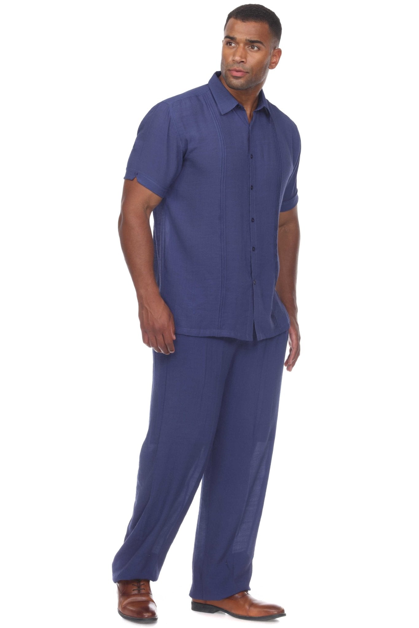 A man wears blue Men’s Casual Drawstring Beach Pants with a matching linen shirt.