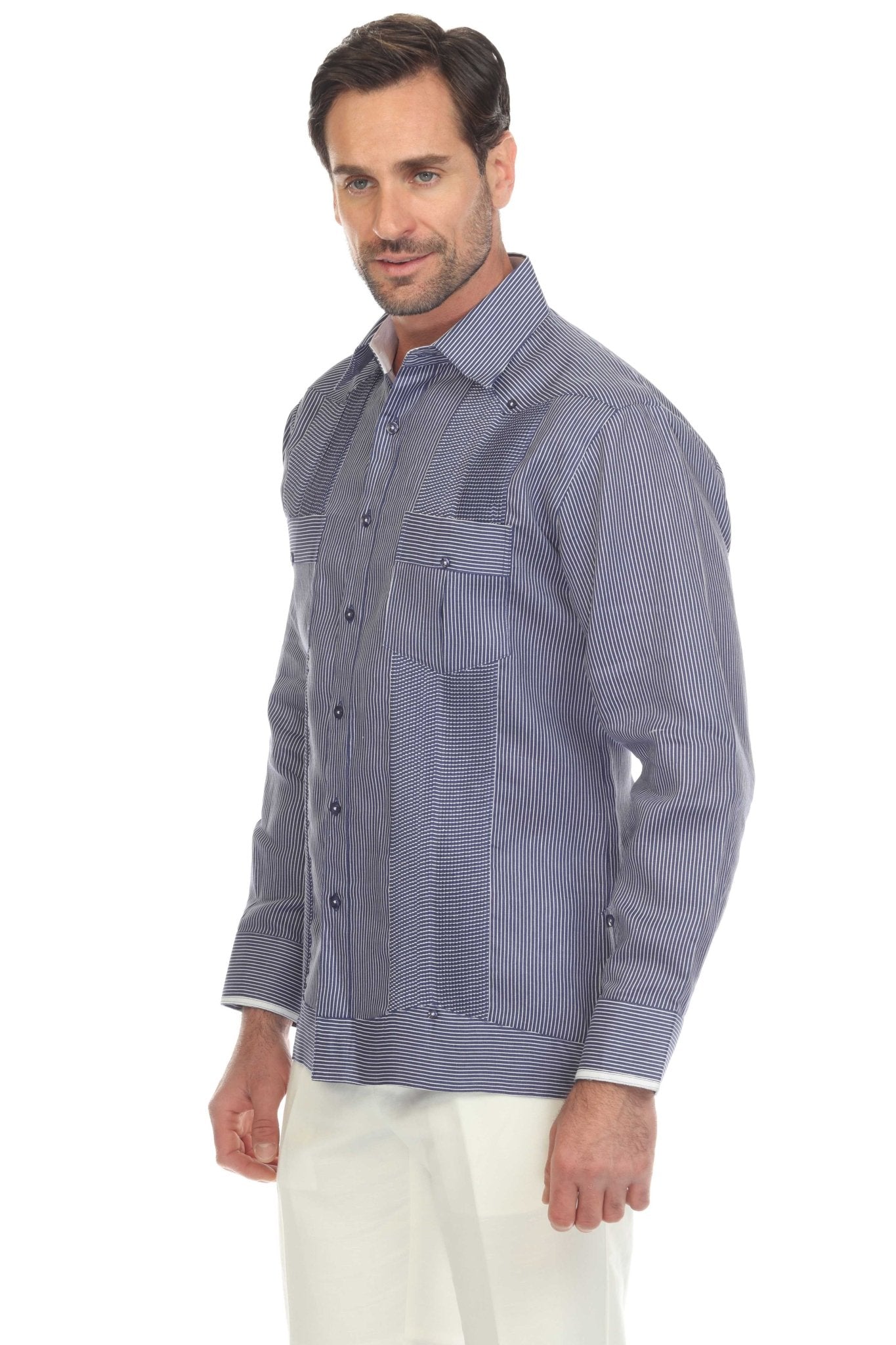 A man wears the blue stripe 100% Linen Contrast Panel Guayabera Shirt Long Sleeve, side-on view.