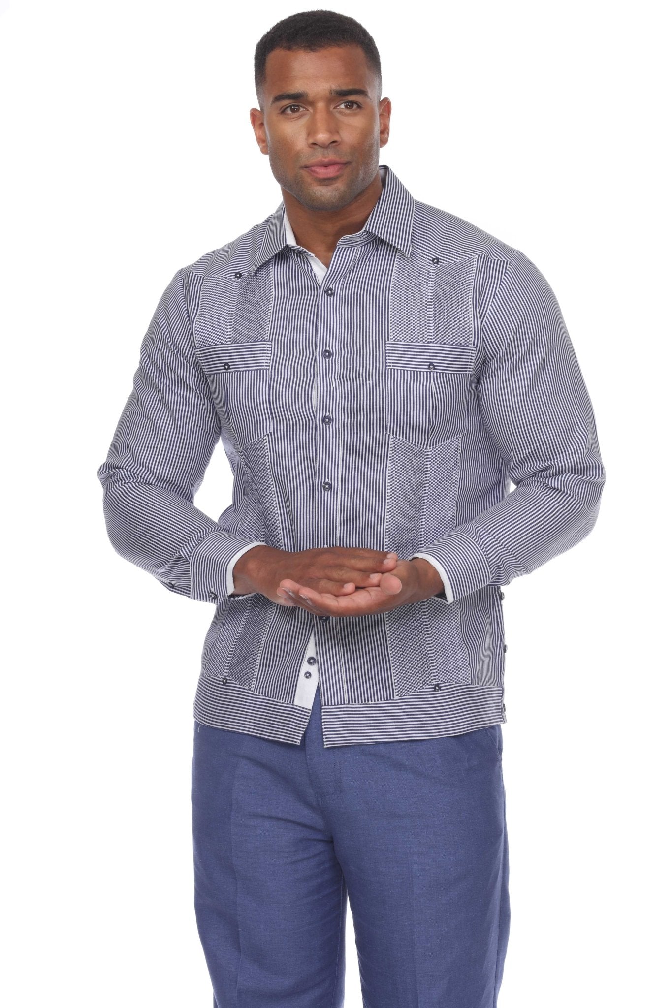 Front view of a model wearing a 100% Linen Contrast Panel Guayabera Shirt Long Sleeve, which is vertically striped with textured panels.