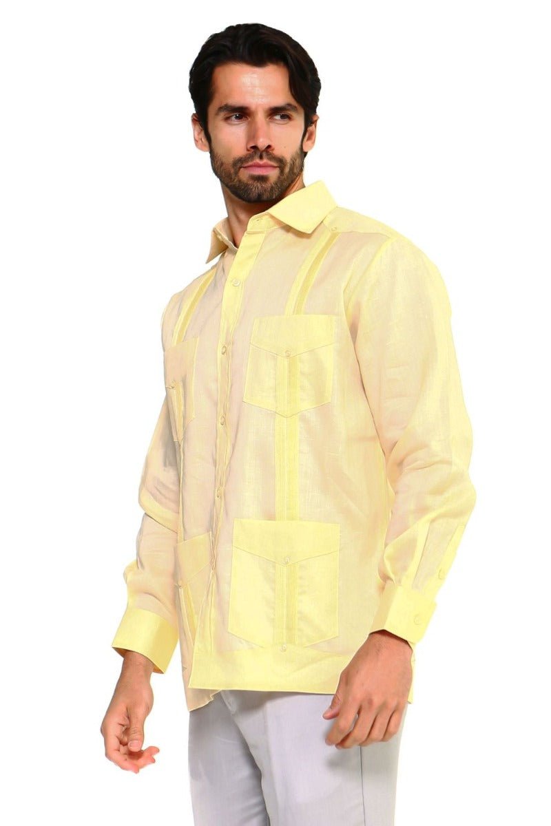 A man models the yellow linen, long-sleeved Big & Tall Guayabera shirt with four pockets.