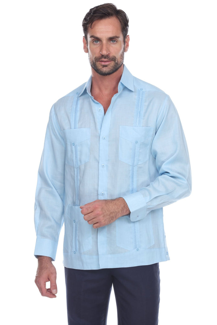 Front view of a man wearing a white Men's Linen Classic Four-Pocket Long Sleeve Guayabera Shirt.