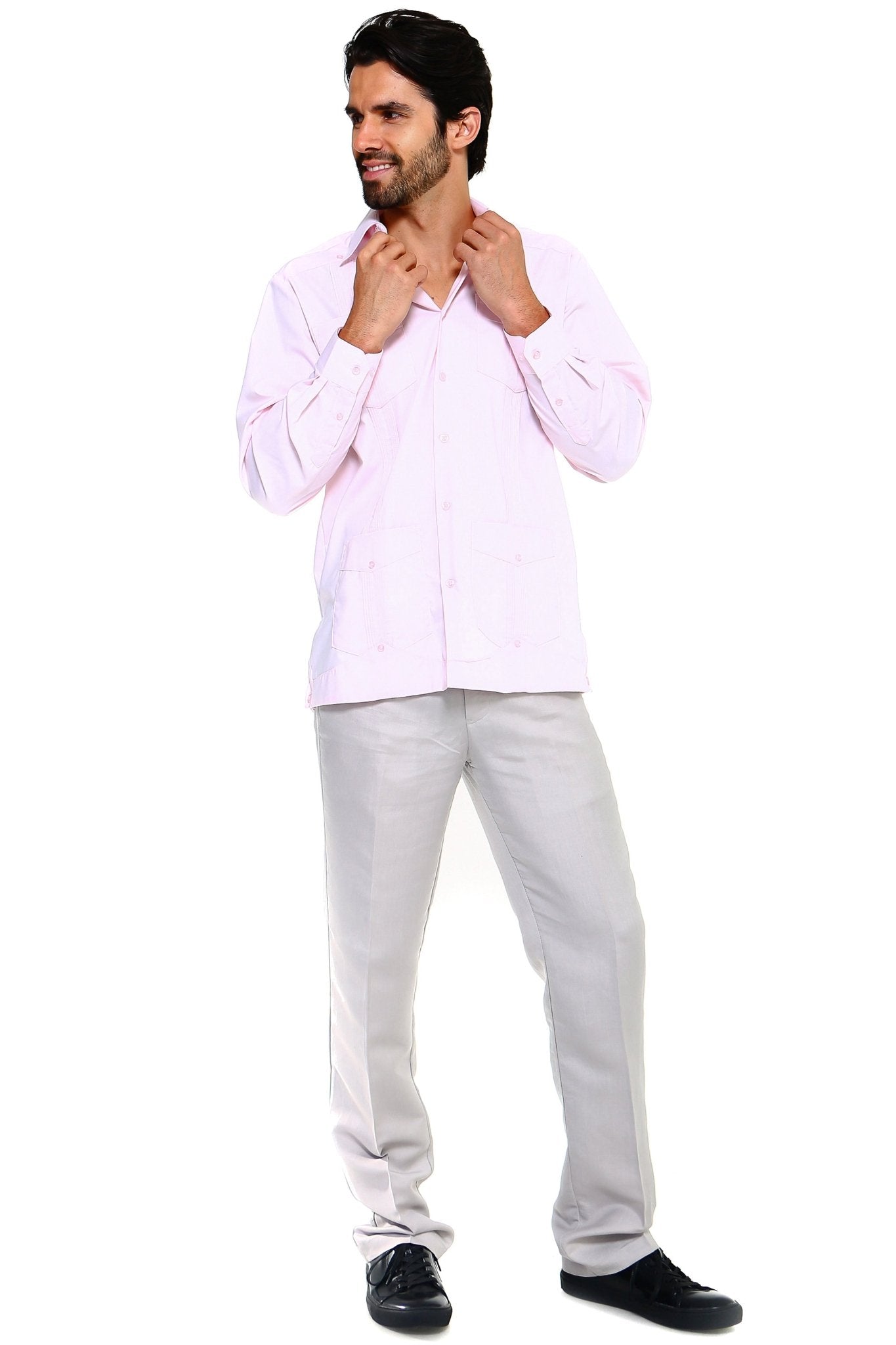 Man wearing a light pink Big & Tall Guayabera Shirt, shown at a slight angle with visible front pockets.