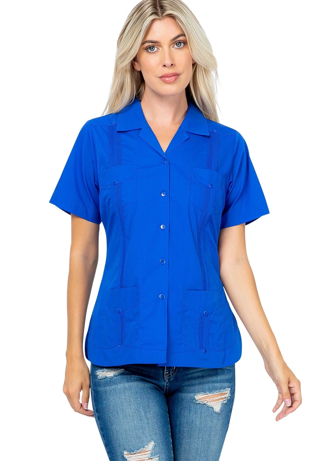 Front view of a woman wearing a blue, short sleeve Guayabera with 4 pockets.