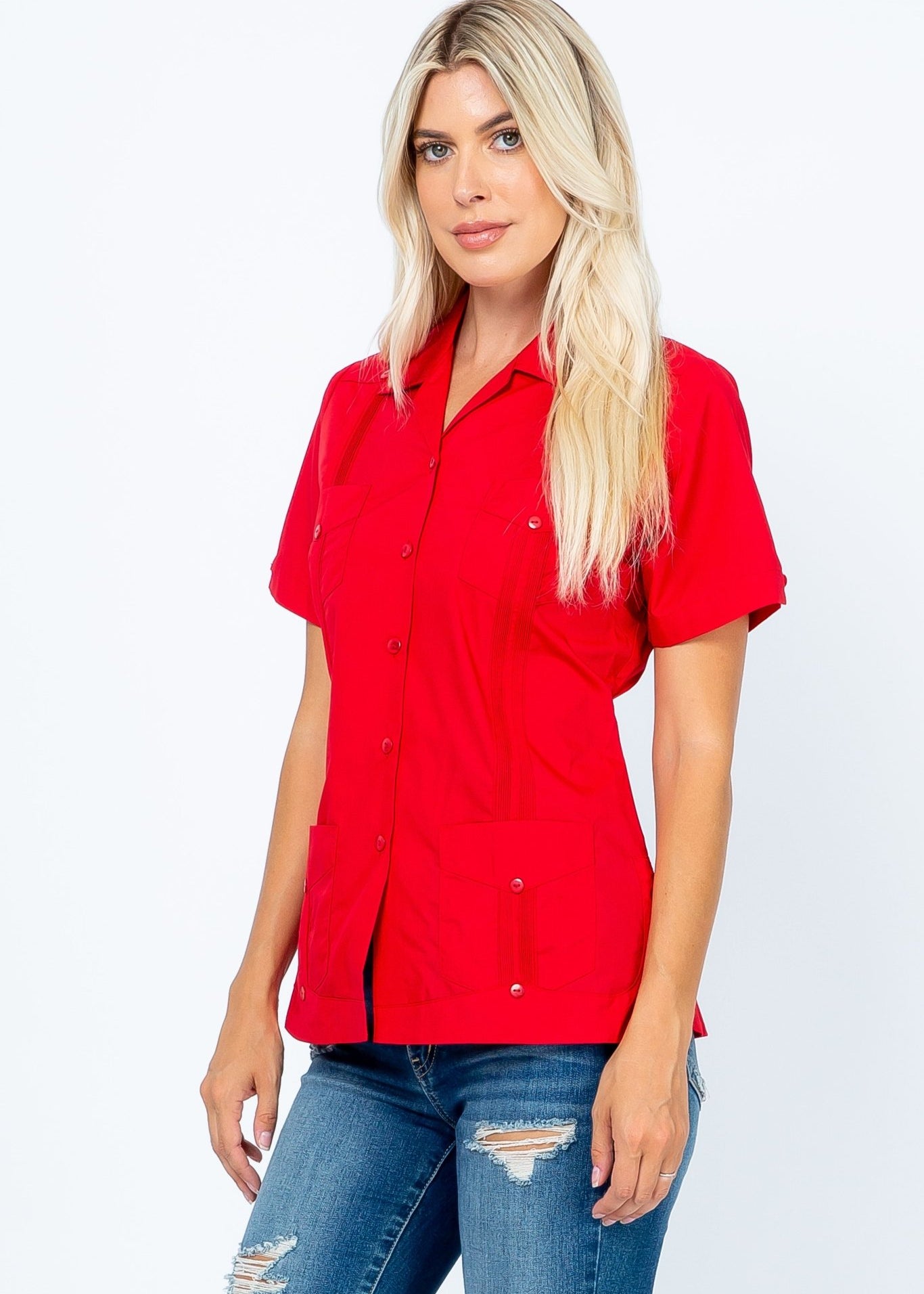 Model wearing a red women's short sleeve guayabera with 4 pockets, shown from the waist up.