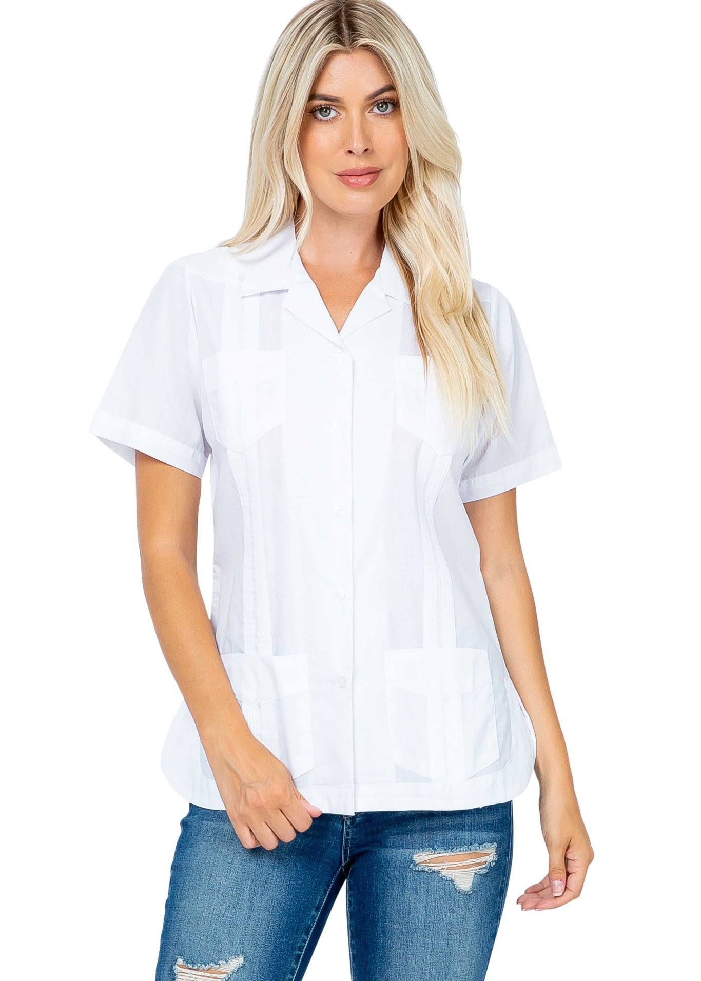 Front view of a woman wearing a white Women's Short Sleeve Guayabera with 4 Pockets and blue jeans.