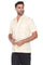 Angled front view of a classic 4-pocket cream guayabera shirt for men made from a breathable cotton-blend.