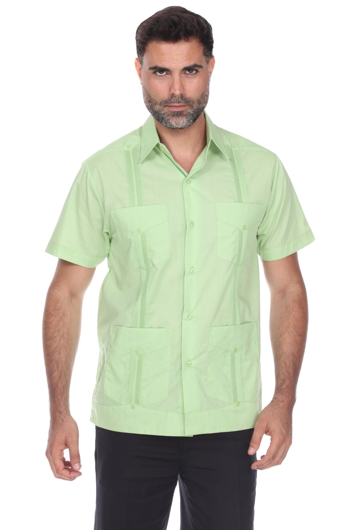 Men’s short sleeve guayabera shirt in light green featuring a classic 4-pocket front and traditional embroidered accents.