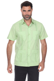Men’s short sleeve guayabera shirt in light green featuring a classic 4-pocket front and traditional embroidered accents.