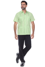 A man wearing a light green Men's Plus Size Classic Four-Pocket Short Sleeve Guayabera Shirt, shown front view.