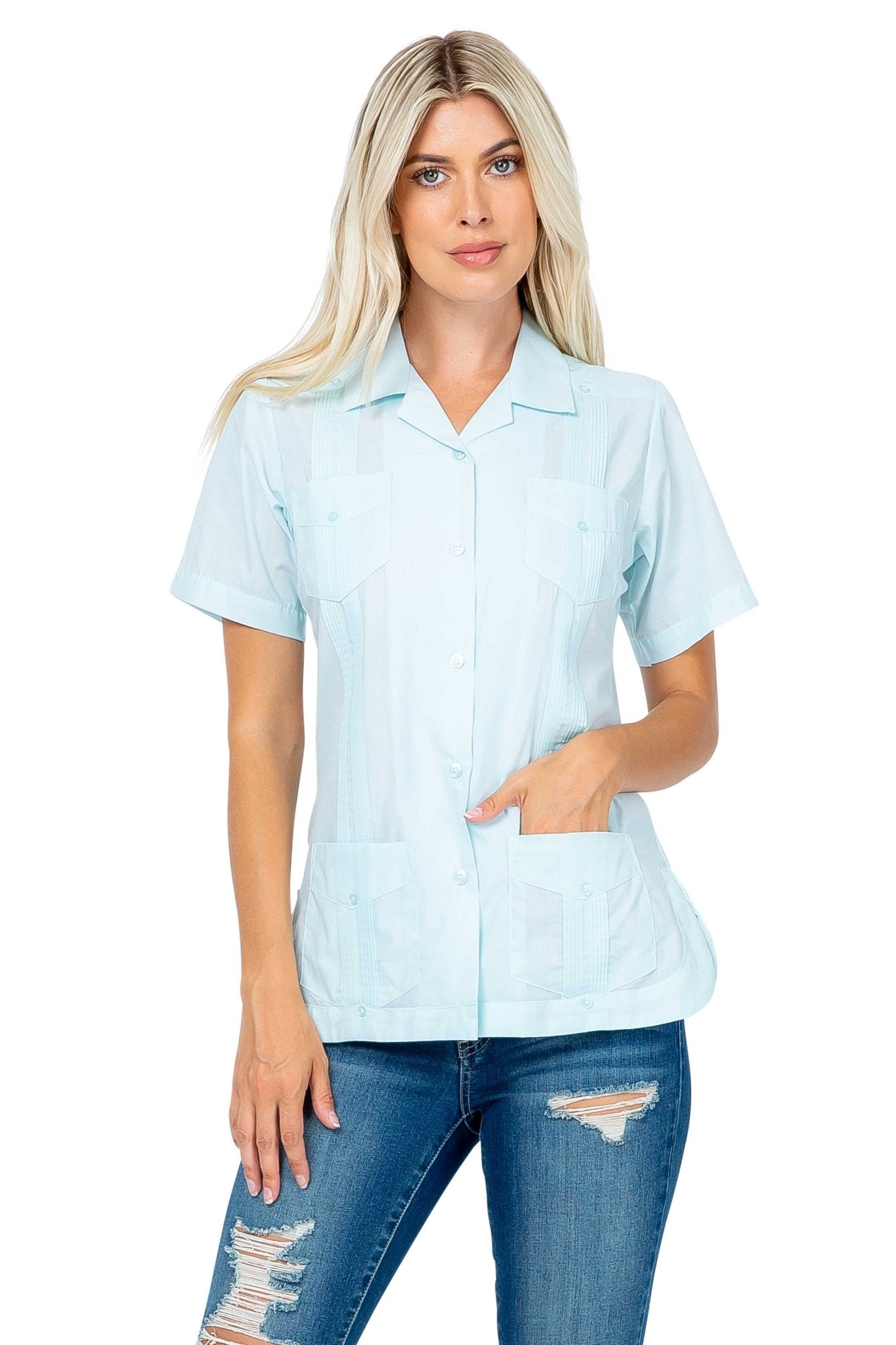 Front view of a light blue Women's Short Sleeve Guayabera with 4 Pockets on a model.