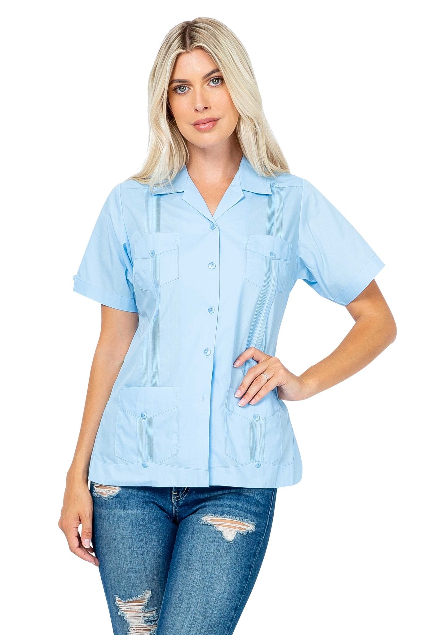 A blonde woman models a light blue Women's Short Sleeve Guayabera with 4 Pockets, shown at a front angle.