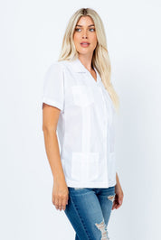 A woman models the white, short-sleeve Women's Guayabera with 4 Pockets, shown from the side.