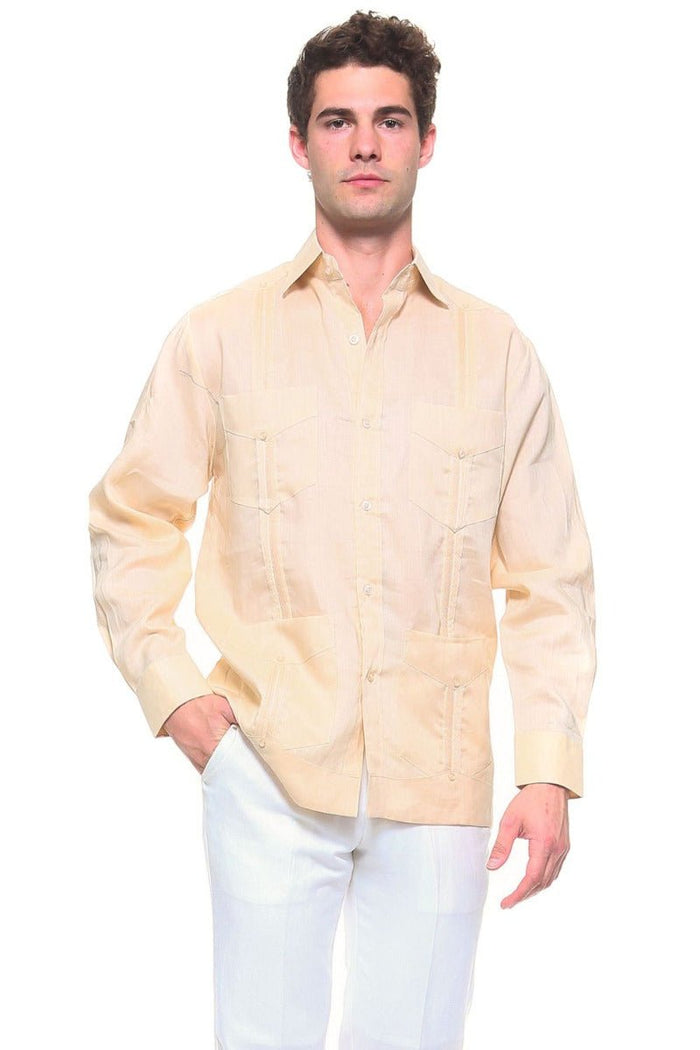 Front view of a man modeling a white, long-sleeve Irish Linen Four Pocket Guayabera Shirt.
