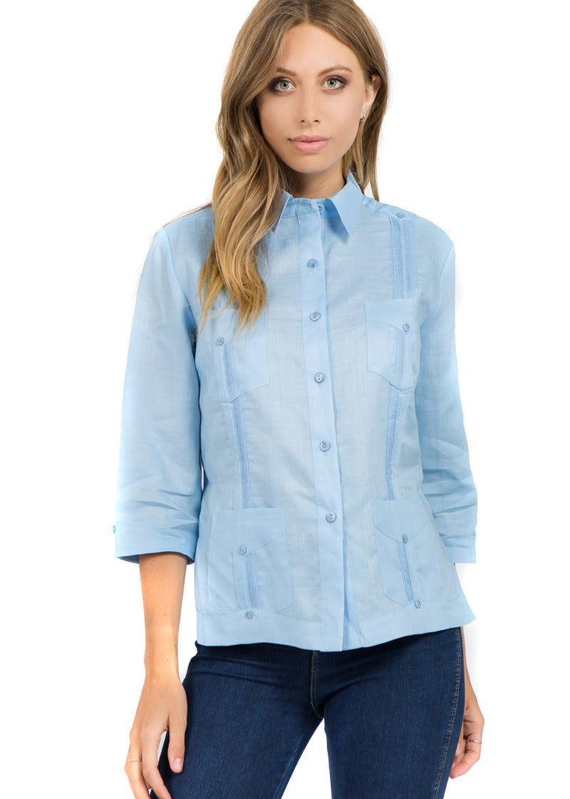 Light blue women's linen Cuban shirt featuring traditional pleats, embroidery, and authentic 4-pockets.