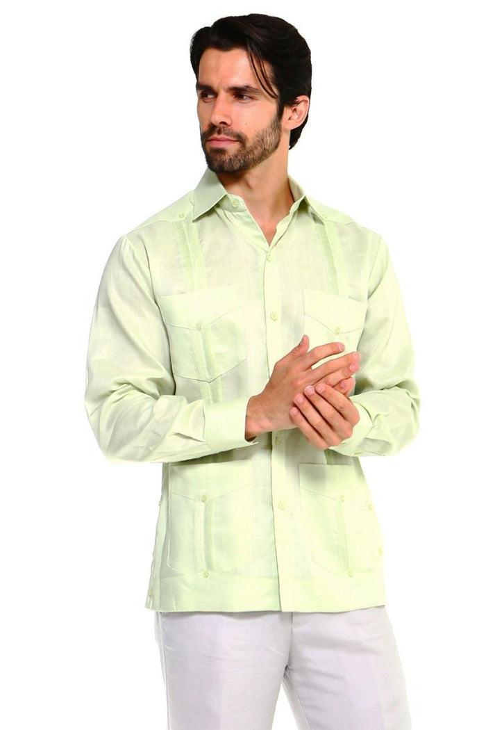 Front view of a man wearing a light beige long-sleeve 4-pocket Men’s Big &amp; Tall Guayabera Shirt.